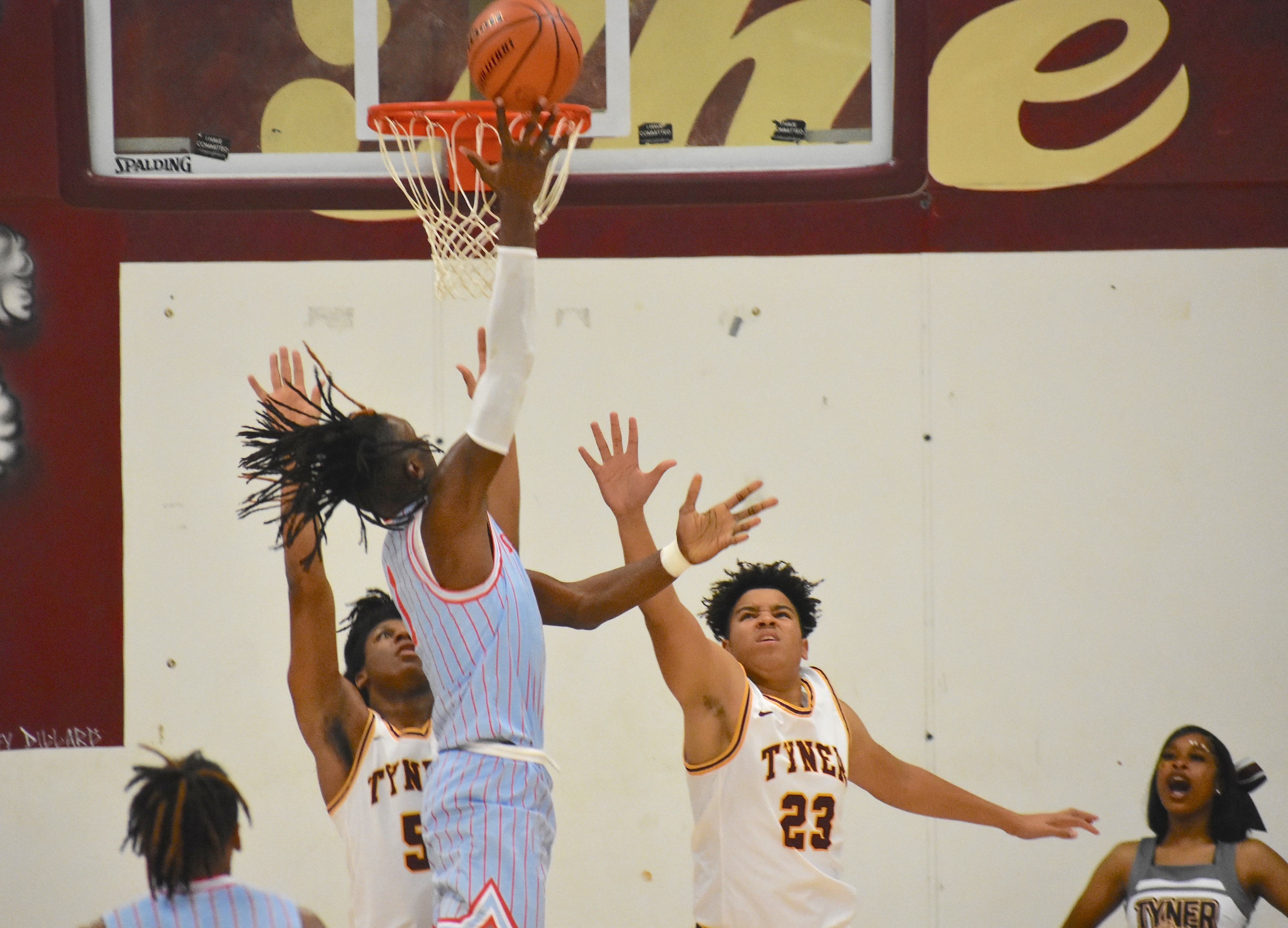 Staff photo by Patrick MacCoon / A Brainerd player rises over Tyner defenders on a shot in the first half.