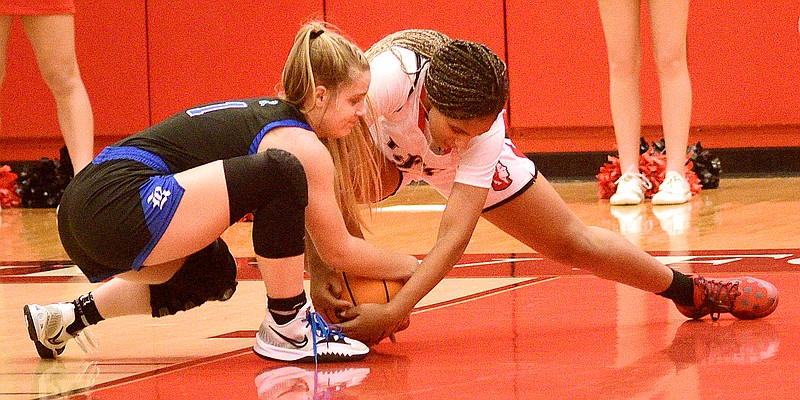 Staff photo by Robin Rudd / Ringgold's Hannah Scott, left, and Lakeview-Fort Oglethorpe's Ziara Thompson fight for a loose ball during a GHSA Region 6-AAA matchup Friday night.