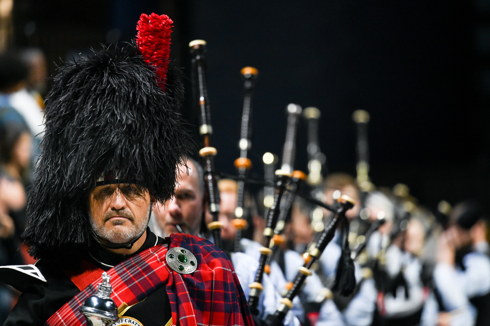 Music department head Stuart Benkert leads the Chattanooga Pipe Band into the arena before the first of two graduation ceremonies for undergraduate students on Saturday, Dec. 11, 2021 in McKenzie Arena. / Photo by Angela Foster