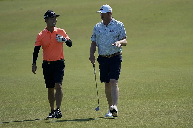 AP file photo by Matt York / Kevin Na, left, and Jason Kokrak teamed up to win the QBE Shootout on Sunday at Tiburon Golf Club in Naples, Fla.