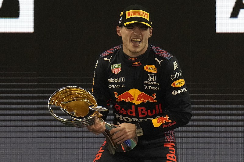AP photo by Hassan Ammar / Red Bull driver Max Verstappen celebrates after winning the Abu Dhabi Grand Prix to clinch the Formula One season championship Sunday in Abu Dhabi, United Arab Emirates.