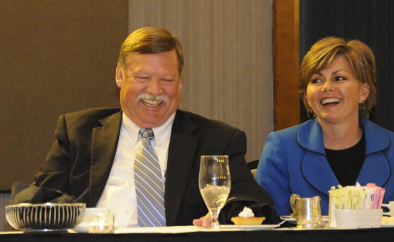 Staff photo / Jim and Nina Coppinger laugh on March 13, 2012, during the third annual Classic 150 "Roast Toast of Champions" at the Chattanoogan Hotel.