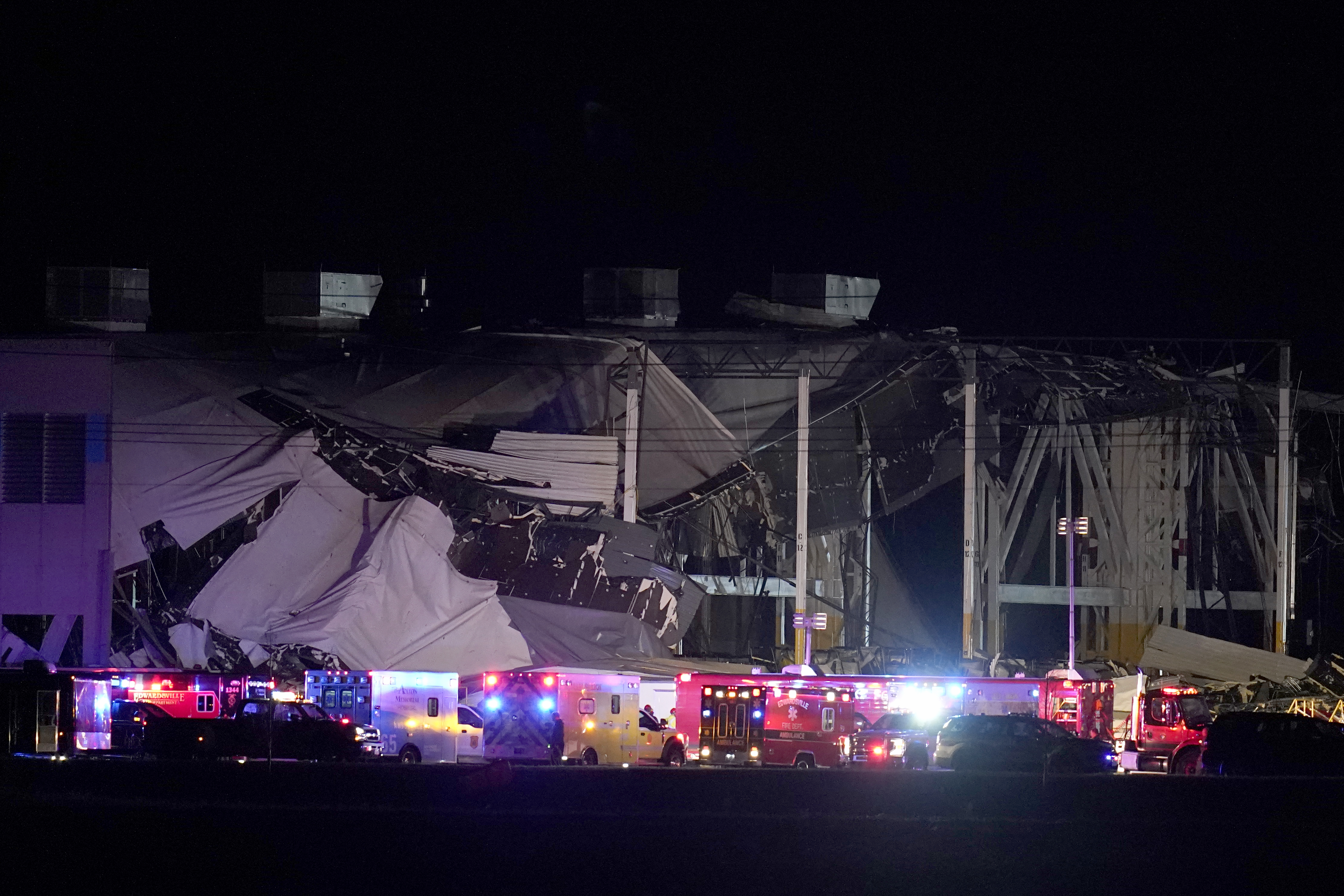 An Amazon distribution center is heavily damaged after a strong thunderstorm moved through the area Friday, Dec. 10, 2021, in Edwardsville, Ill. Tornadoes and severe weather were blamed for several deaths and injuries across parts of the Midwest and the South as a storm system caused significant damage at a candle factory in Kentucky, an Amazon facility in Illinois, a nursing home in Arkansas, and numerous homes and buildings.(AP Photo/Jeff Roberson)