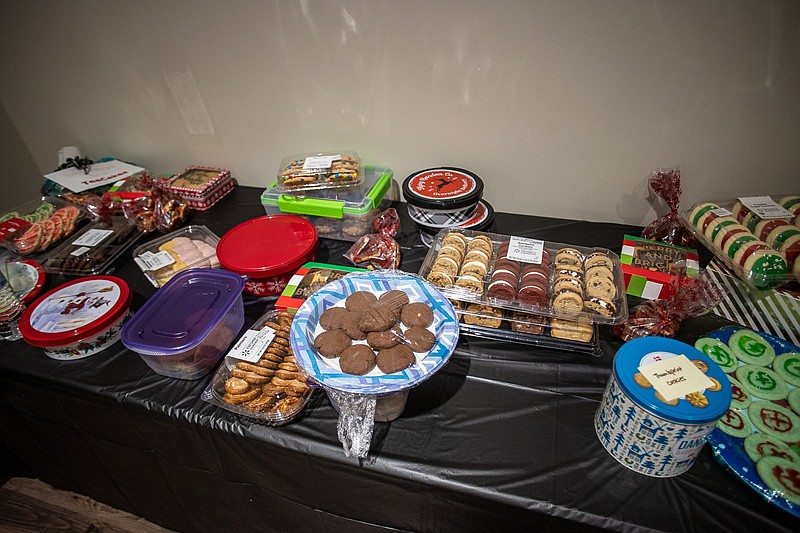 Staff photo by Troy Stolt / Cookies — a dozen from each participant — await the end of dinner so the cookie exchange can begin during the Chattanooga Area Geocachers party at Tri-Community Volunteer Fire Department in Apison.