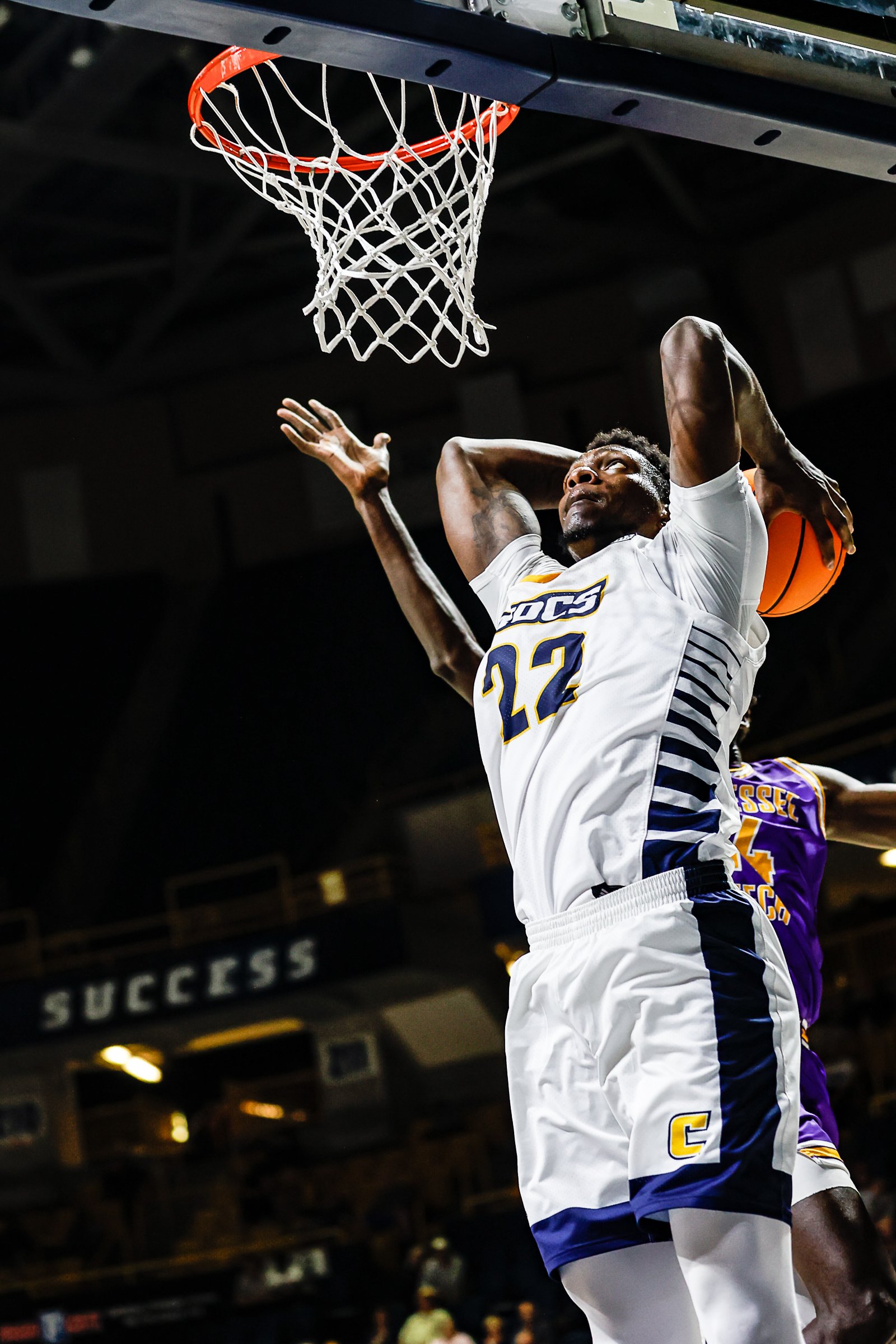 Staff photo by Troy Stolt / Mocs forward Silvio De Sousa (22) goes for a slam dunk during UTC's home basketball game against the Tennessee Tech Golden Eagles at McKenzie Arena on Tuesday, Nov. 16, 2021 in Chattanooga, Tenn.