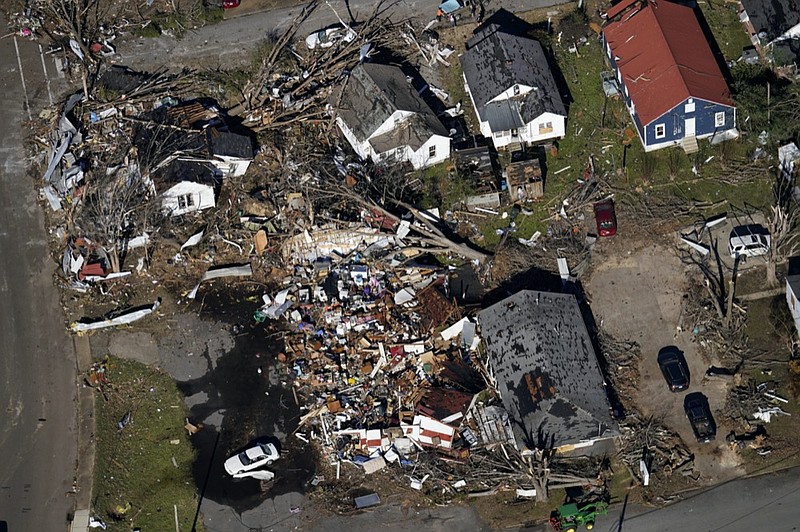 In this aerial photo, destroyed homes are seen in the aftermath of tornadoes that tore through the region in Dresden, Tenn., Sunday, Dec. 12, 2021. (AP Photo/Gerald Herbert)