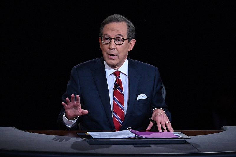 File photo by Olivier Douliery/Pool via The Associated Press / Moderator Chris Wallace of Fox News, shown here speaking as President Donald Trump and Democratic presidential candidate former Vice President Joe Biden participate in the first presidential debate in Cleveland on Sept. 29, 2020, said he is leaving Fox after 18 years.