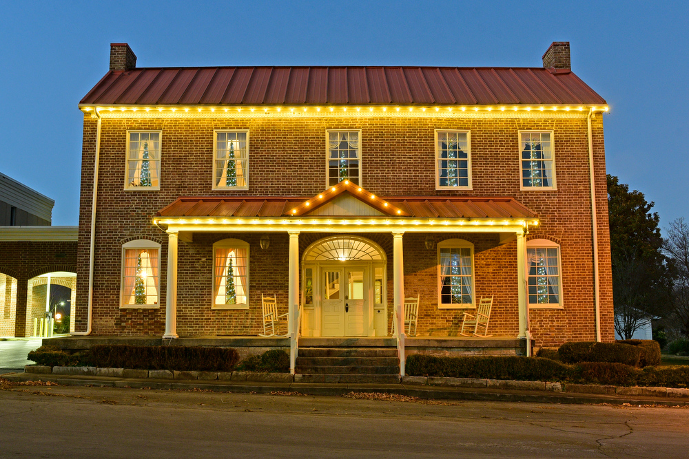 Staff Photo by Robin Rudd / Small Christmas trees decorate Tuesday the windows of this building just off Main Street on Spring Street in Pikeville, Tennessee. Pushed through by the vision of resident and business owner Lola Sells and the help of many others, downtown Pikeville has been transformed this year with the goal of having Christmas decorations (preferably lights) on every home and business on the main street through downtown. Sells says her goal is to make it look like a Hallmark town that people would want to come visit and spend money in.