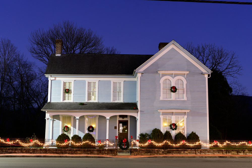 Staff Photo by Robin Rudd / The historic Dr. James Ross house is decorated Tuesday. Pushed through by the vision of resident and business owner Lola Sells and the help of many others, downtown Pikeville, Tennessee, has been transformed this year with the goal of having Christmas decorations (preferably lights) on every home and business on the main street through downtown. Sells says her goal is to make it look like a Hallmark town that people would want to come visit and spend money in.