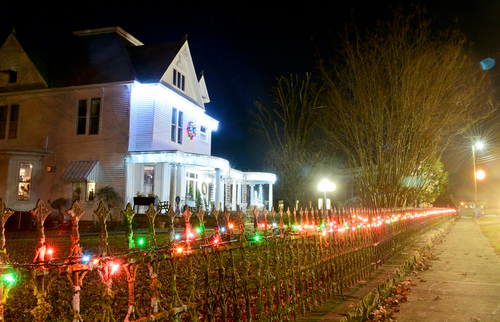 Staff Photo by Robin Rudd / Homes south of downtown on Main Street are decorated Tuesday. Pushed through by the vision of resident and business owner Lola Sells and the help of many others, downtown Pikeville, Tennessee, has been transformed this year with the goal of having Christmas decorations (preferably lights) on every home and business on the main street through downtown. Sells says her goal is to make it look like a Hallmark town that people would want to come visit and spend money in.