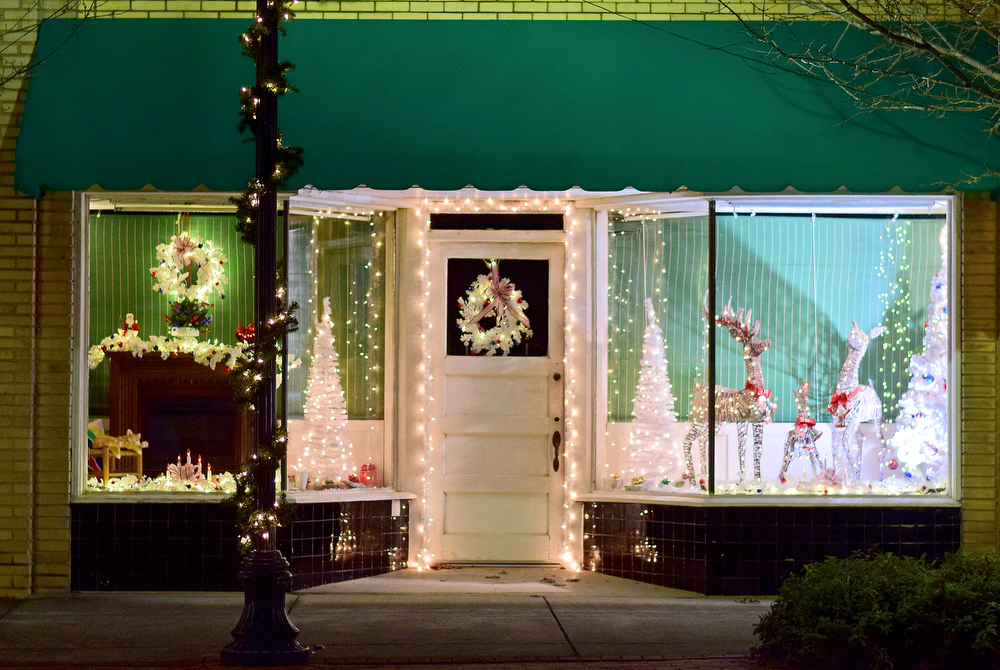 Staff Photo by Robin Rudd / A storefront is decorated Tuesday. Pushed through by the vision of resident and business owner Lola Sells and the help of many others, downtown Pikeville, Tennessee, has been transformed this year with the goal of having Christmas decorations (preferably lights) on every home and business on the main street through downtown. Sells says her goal is to make it look like a Hallmark town that people would want to come visit and spend money in.
