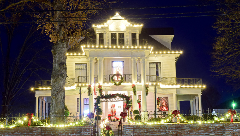 Staff Photo by Robin Rudd / Homes south of downtown on Main Street are decorated Tuesday. Pushed through by the vision of resident and business owner Lola Sells and the help of many others, downtown Pikeville, Tennessee, has been transformed this year with the goal of having Christmas decorations (preferably lights) on every home and business on the main street through downtown. Sells says her goal is to make it look like a Hallmark town that people would want to come visit and spend money in.