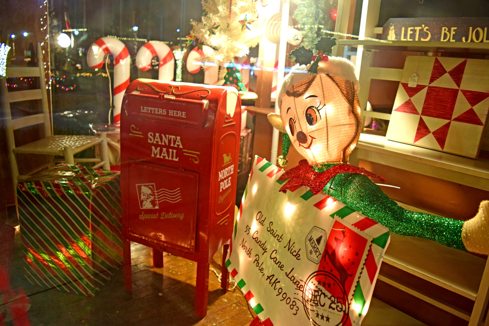Staff Photo by Robin Rudd / A "Letters to Santa" display is shown Tuesday in the window of the Nickel Row Antique Mall. Pushed through by the vision of resident and business owner Lola Sells and the help of many others, downtown Pikeville, Tennessee, has been transformed this year with the goal of having Christmas decorations (preferably lights) on every home and business on the main street through downtown. Sells says her goal is to make it look like a Hallmark town that people would want to come visit and spend money in.