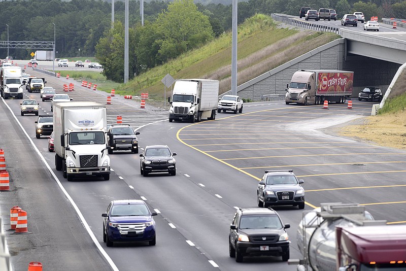 Staff file photo by Robin Rudd / Traffic moves through the junction of Interstate-24 West, at left, and Interstate-75 North, on an August morning. Until phase 2 of the Split project is begun and finished, the backup on I-75's ramp to I-24 will linger at the two-into-one lane merger.