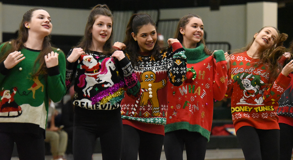 Staff Photo by Matt Hamilton / The Irish Charms dance team perform a routine dressed in Christmas sweaters during halftime of the Notre Dame High School basketball game against Baylor on Friday, December 17, 2021.