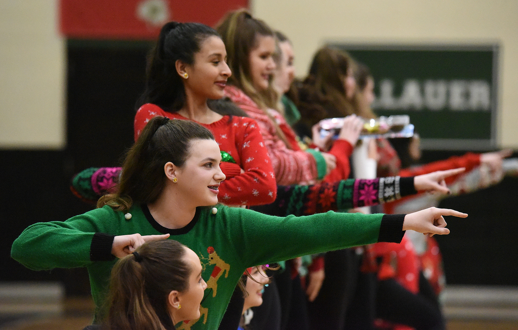 Staff Photo by Matt Hamilton / The Irish Charms dance team perform a routine dressed in Christmas sweaters during halftime of the Notre Dame High School basketball game against Baylor on Friday, December 17, 2021.