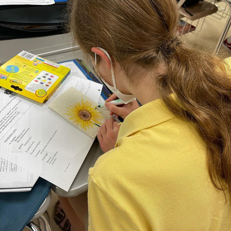 Contributed photo by Amber Thevenet / Greetja Nestler, an 11th grader at Signal Mountain Middle High School, prepares a get-well card for a child in a French hospital.