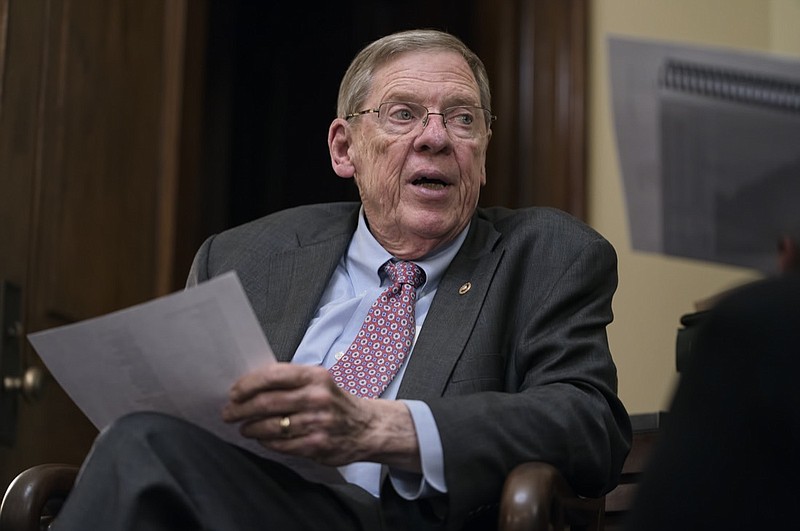 FILE - Sen. Johnny Isakson, R-Ga., meets with his staff in his office on Capitol Hill in Washington, Dec. 2, 2019. Isakson, an affable Georgia Republican politician who rose from the ranks of the state Legislature to become a U.S. senator, has died. He was 76. Georgia Gov. Brian Kemp's office confirmed the death in a news release Sunday, Dec. 19, 2021. (AP Photo/J. Scott Applewhite, file)