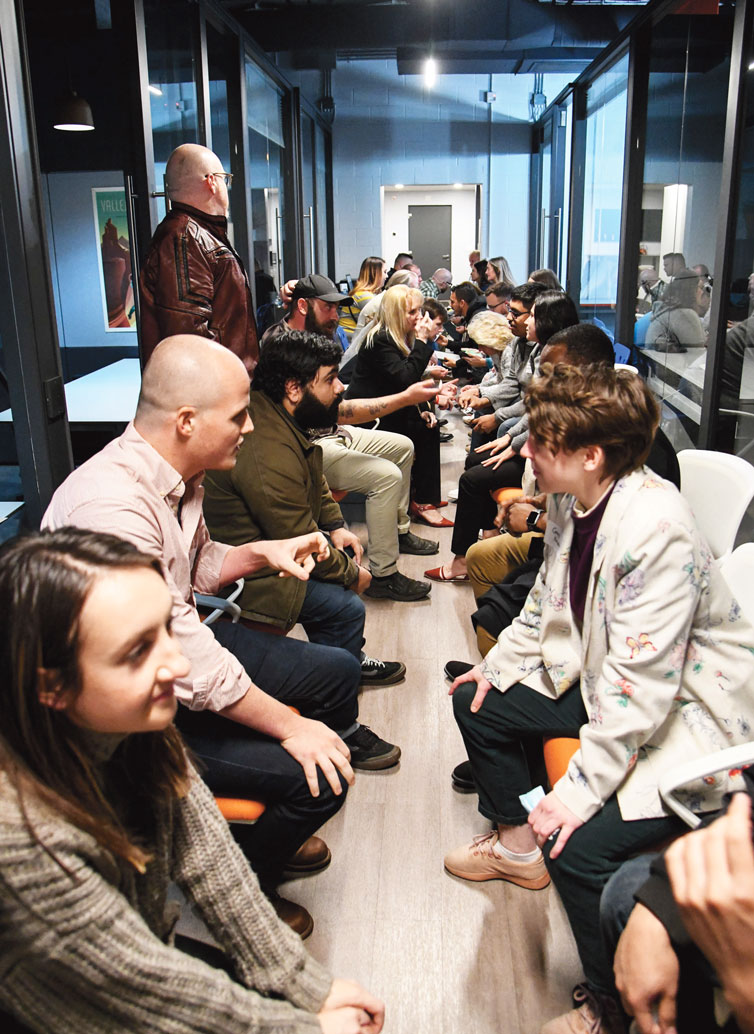 Photography by Mark Gilliland / Attendees participate in a speed networking session at DStation Creative Space