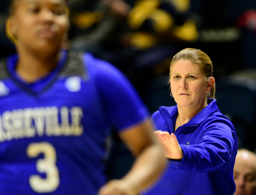 Staff Photo by Robin Rudd / Asheville head coach Honey Brown directs the Bulldogs. The University of Tennessee at Chattanooga Mocs hosted the University of Asheville in NCAA women's basketball at McKenzie Arena on December 20, 2021.