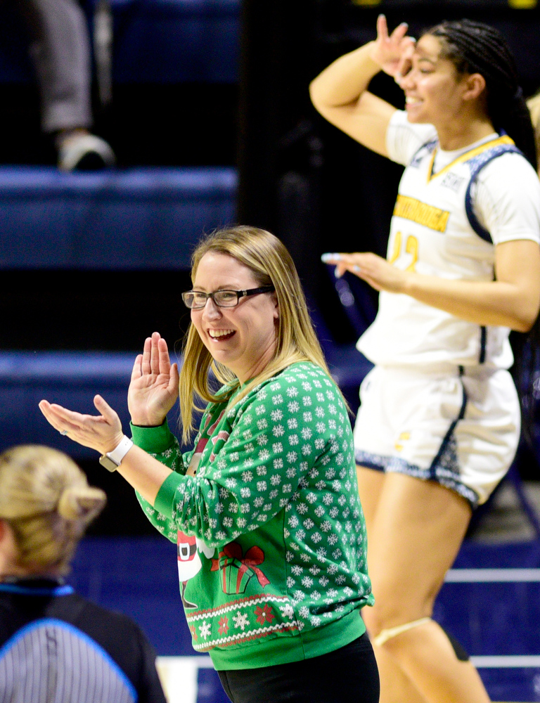 Staff Photo by Robin Rudd / UTC head coach Katie Burrows and Brooke Hampel (22) celebrate a three-point goal. The University of Tennessee at Chattanooga Mocs hosted the University of Asheville in NCAA women's basketball at McKenzie Arena on December 20, 2021.