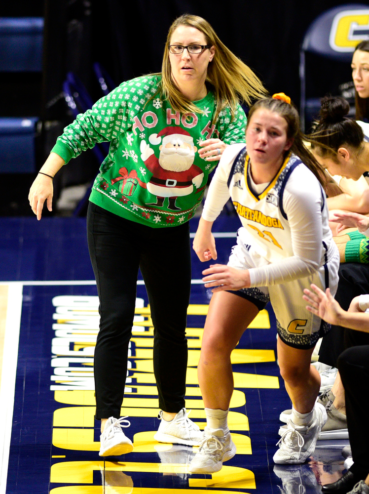 Staff Photo by Robin Rudd / UTC head coach Katie Burrows sends Addie Grace Porter (21) into the game. The University of Tennessee at Chattanooga Mocs hosted the University of Asheville in NCAA women's basketball at McKenzie Arena on December 20, 2021.