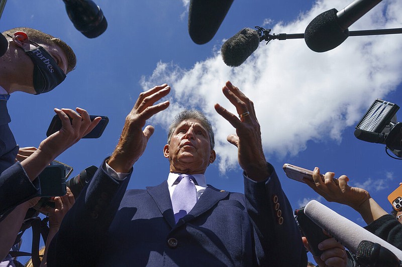 Sen. Joe Manchin, D-W.Va., a centrist Democrat vital to the fate of President Joe Biden's $3.5 government overhaul, updates reporters about his position on the bill, at the Capitol in Washington, Thursday, Sept. 30, 2021. Despite months of being courted and cajoled, Sen. Joe Manchin is still not a yes on President Joe Biden's big $2 trillion domestic package and has thrown Democrats into turmoil. (AP Photo/J. Scott Applewhite, File)