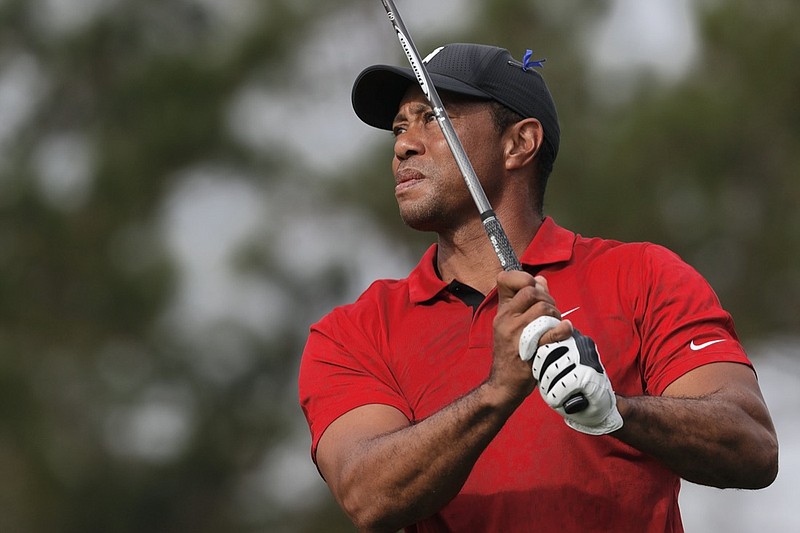 Tiger Woods tees off on the second hole during the second round of the PNC Championship golf tournament Sunday, Dec. 19, 2021, in Orlando, Fla. (AP Photo/Scott Audette)