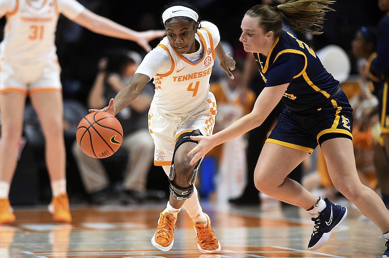 Tennessee guard Jordan Walker (4) steals the ball from East Tennessee guard Sarah Thompson (23) in an NCAA college basketball game in Knoxville, Tenn., Monday, Dec. 20, 2021. (Saul Young/Knoxville News Sentinel via AP)