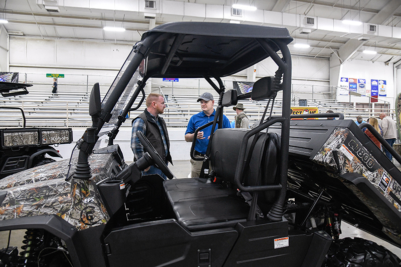Photo by Mark Gilliland / John Stubblefield and Randy Hatfield check out the Greenworks electric utility vehicle.