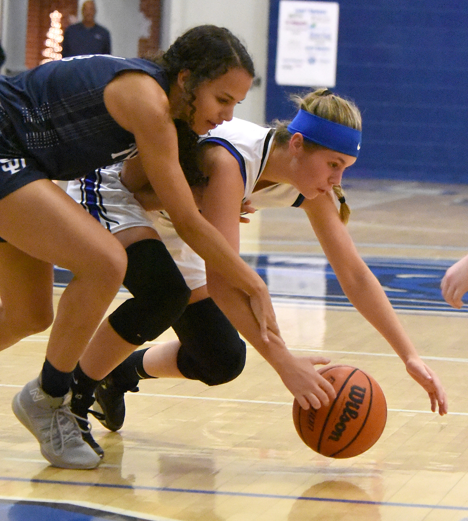 Staff Photo by Matt Hamilton / Soddy Daisy (4) Adyson Collins battles for the ball with Sale Creek (21) Molly Welch on Tuesday, December 21, 2021 during the championship game of the Sale Creek Christmas basketball tournament. Soddy Daisy went on to win 56-43.