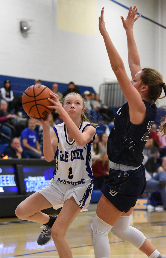 Staff Photo by Matt Hamilton / Soddy Daisy (24) Cam Varner defends as Sale Creek (2) Madi Ellis takes a shot on Tuesday, December 21, 2021 during the championship game of the Sale Creek Christmas basketball tournament. Soddy Daisy went on to win 56-43.