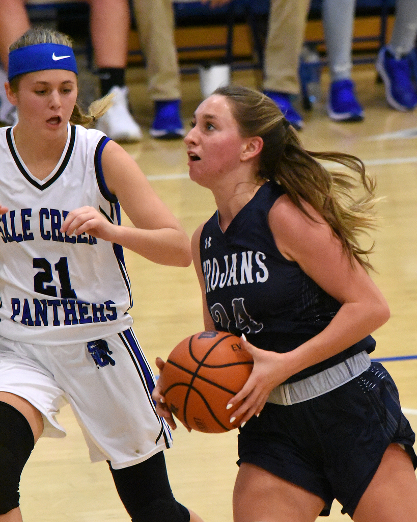 Staff Photo by Matt Hamilton / Soddy Daisy (24) Cam Varner drives to the hoop as Sale Creek (21) Molly Welch defends on Tuesday, December 21, 2021 during the championship game of the Sale Creek Christmas basketball tournament. Soddy Daisy went on to win 56-43.