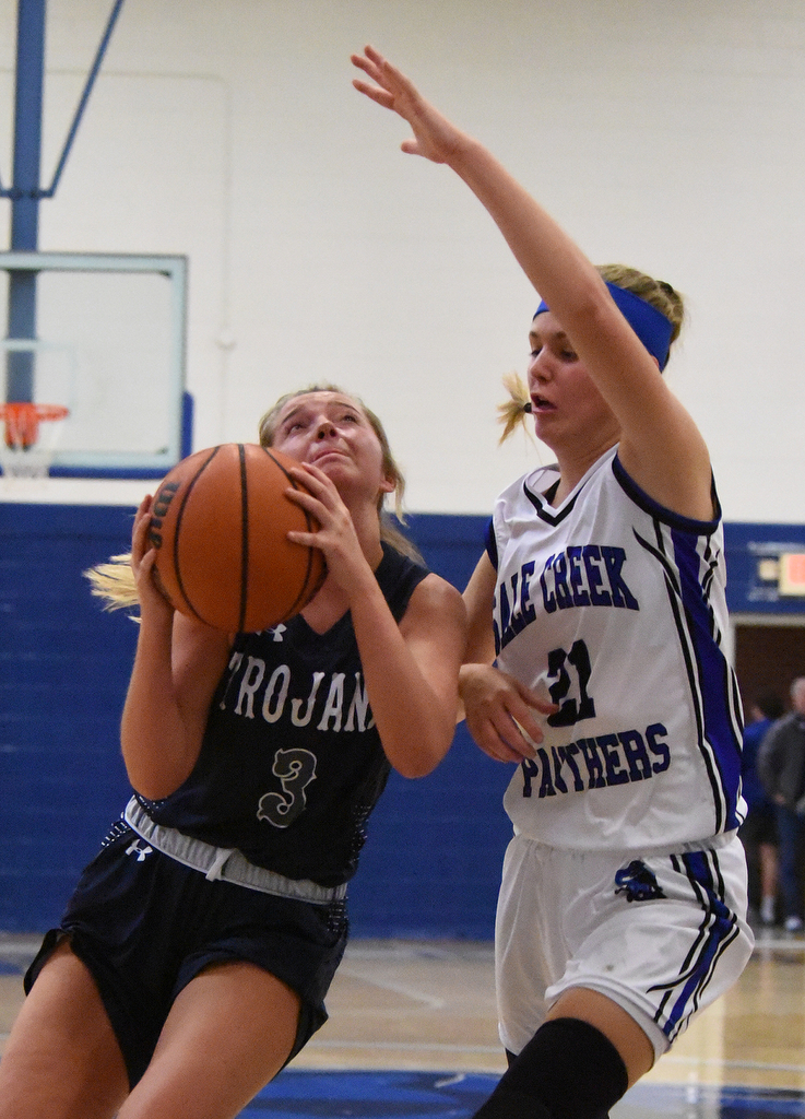 Staff Photo by Matt Hamilton / Soddy Daisy (3) Melody Crawley drives to the hoop as Sale Creek (21) Molly Welch defends on Tuesday, December 21, 2021 during the championship game of the Sale Creek Christmas basketball tournament. Soddy Daisy went on to win 56-43.