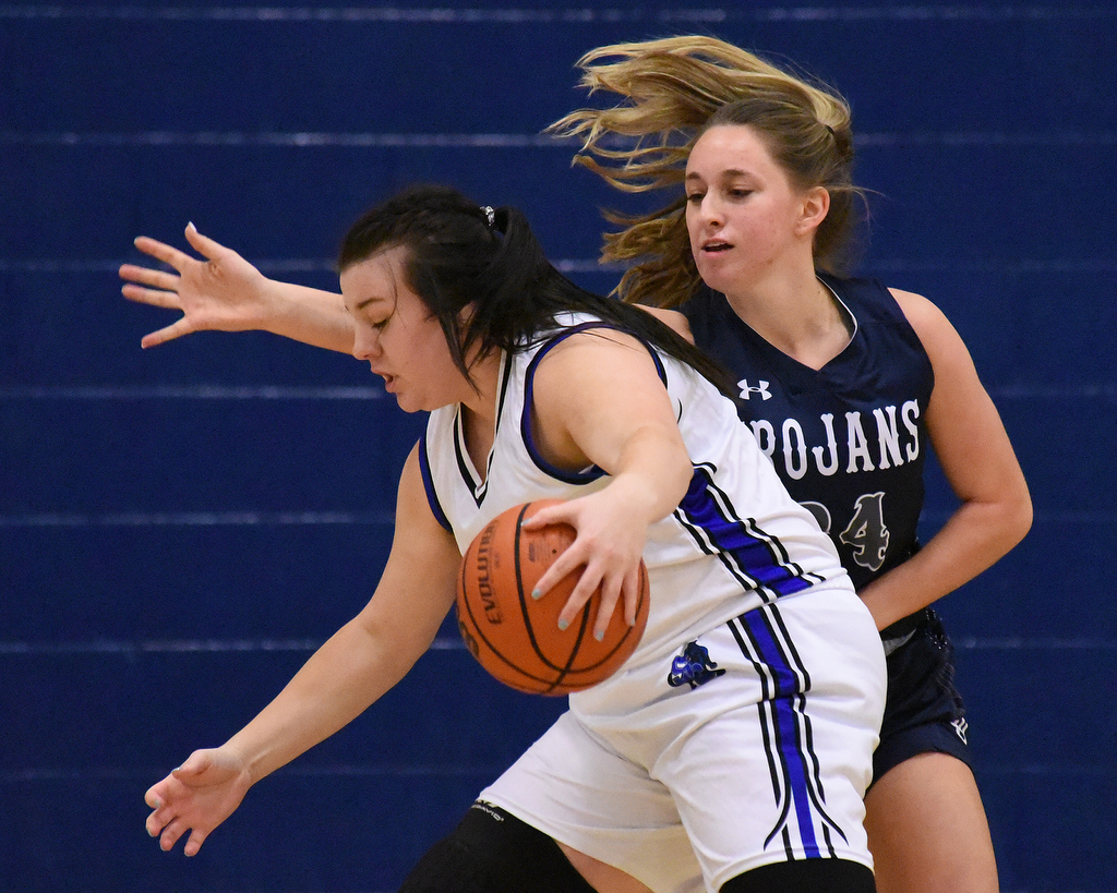 Staff Photo by Matt Hamilton / Soddy Daisy (24) Cam Varner defends as Sale Creek (3) Kayla Phillips dribbles on Tuesday, December 21, 2021 during the championship game of the Sale Creek Christmas basketball tournament. Soddy Daisy went on to win 56-43.