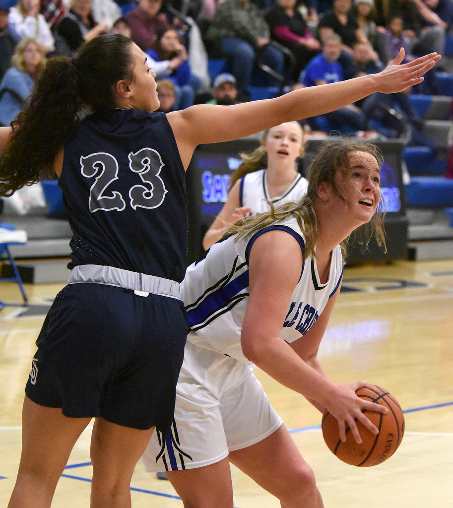 Staff Photo by Matt Hamilton / Soddy Daisy (23) Jada Trimiar defends as Sale Creek (32) Keilyn Morgan looks to takes a shot on Tuesday, December 21, 2021 during the championship game of the Sale Creek Christmas basketball tournament. Soddy Daisy went on to win 56-43.