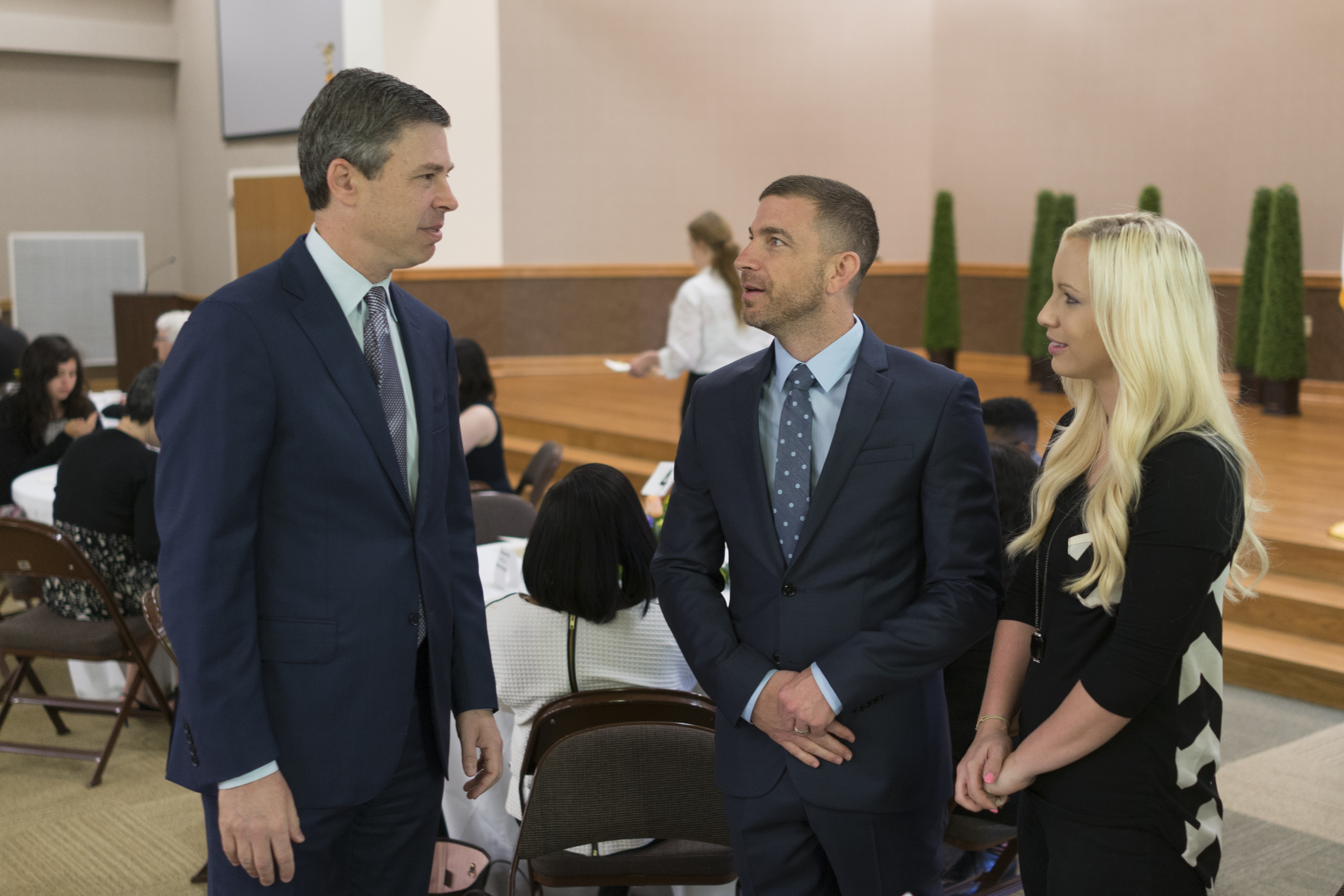 Staff File Photo / Andy Berke, then mayor of Chattanooga, speaks to Tavner Smith, the pastor of Venue Church, and his wife Danielle Smith during a prayer breakfast celebrating the inauguration of Berke and Chattanooga City Council members at Orchard Knob Missionary Baptist Church on April 17, 2017.