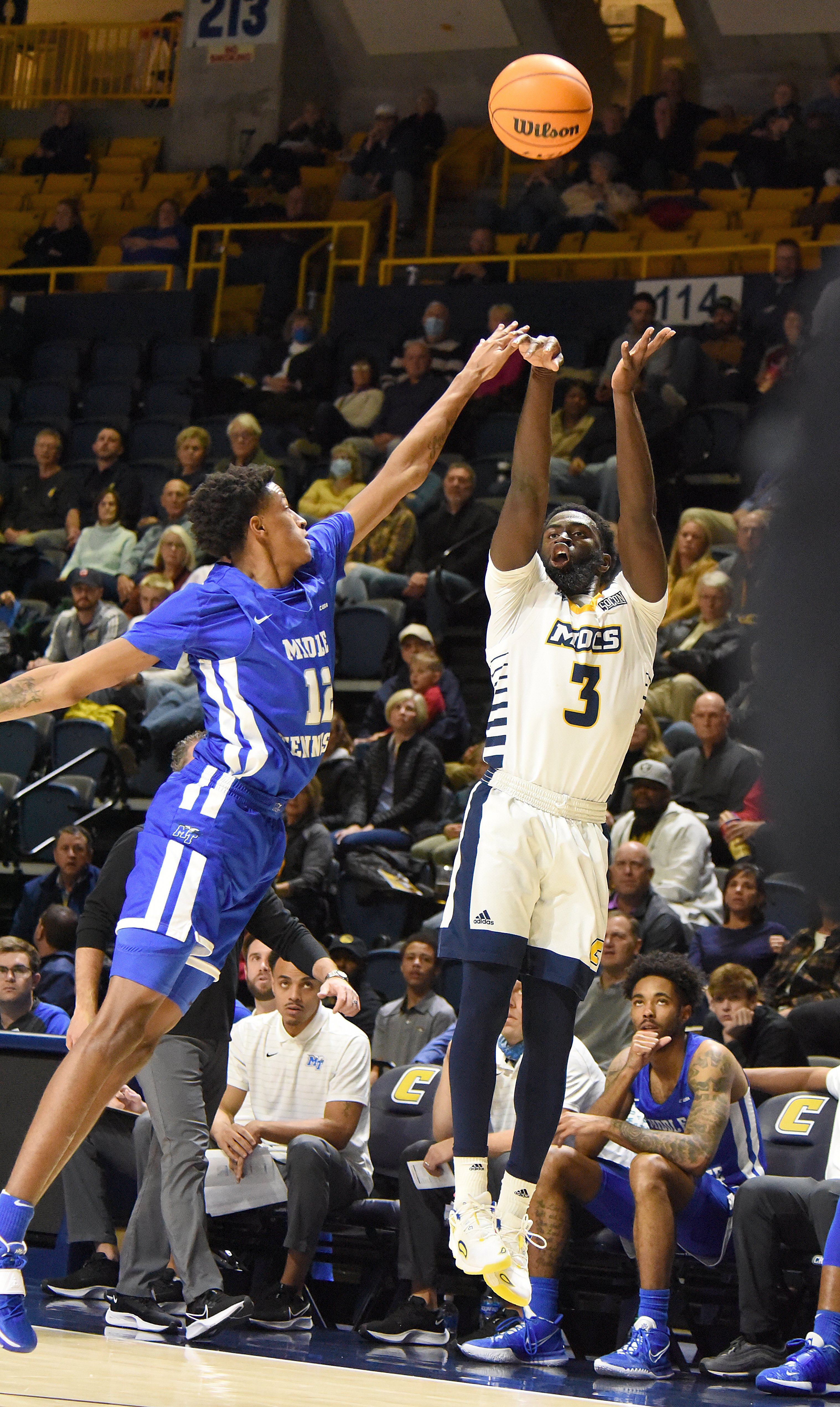Staff Photo by Matt Hamilton / Middle Tennessee State (12) Teafale Lenard defends UTC (3) David Jean-Baptiste as he takes a shot on Wednesday, December 22, 2021 at McKenzie Arena.