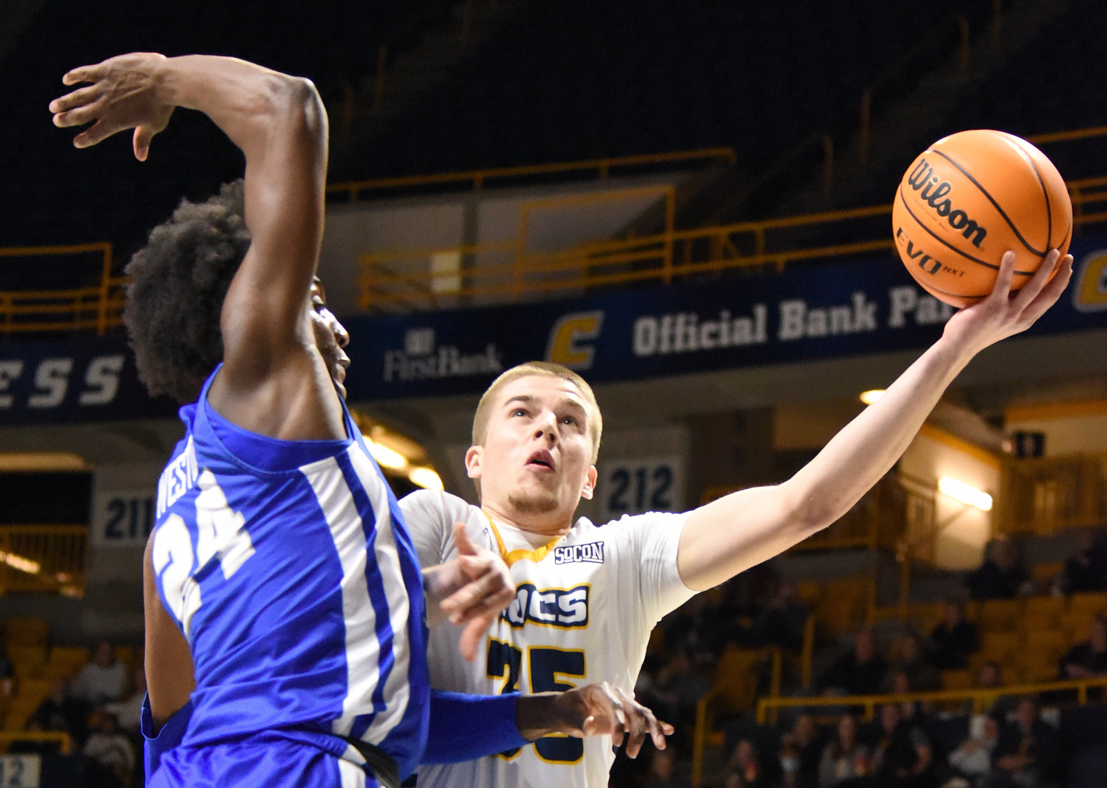 Staff Photo by Matt Hamilton / Middle Tennessee State (24) Camryn Weston defends UTC (35) Grant Ledford as he takes a shot on Wednesday, December 22, 2021 at McKenzie Arena.