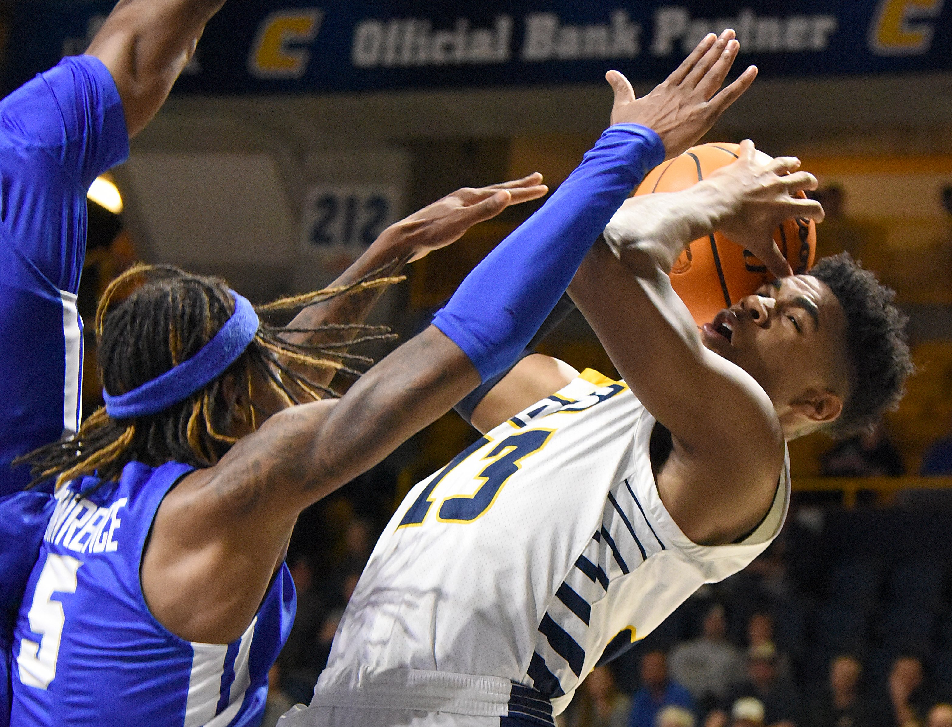 Staff Photo by Matt Hamilton / Middle Tennessee State (5) Eli Lawrence defends UTC (13) Malachi Smith as he takes a shot on Wednesday, December 22, 2021 at McKenzie Arena.