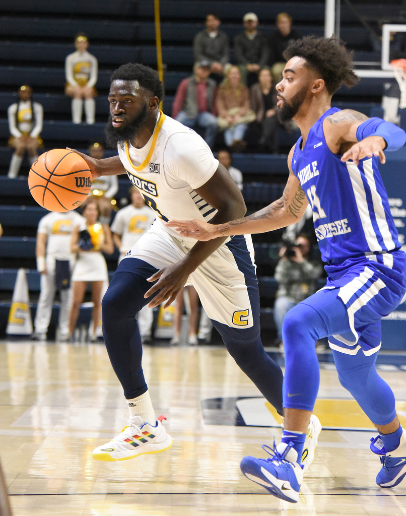 Staff Photo by Matt Hamilton / Middle Tennessee State (11) Josh Jefferson defends UTC (3) David Jean-Baptiste as he drives down the court on Wednesday, December 22, 2021 at McKenzie Arena.