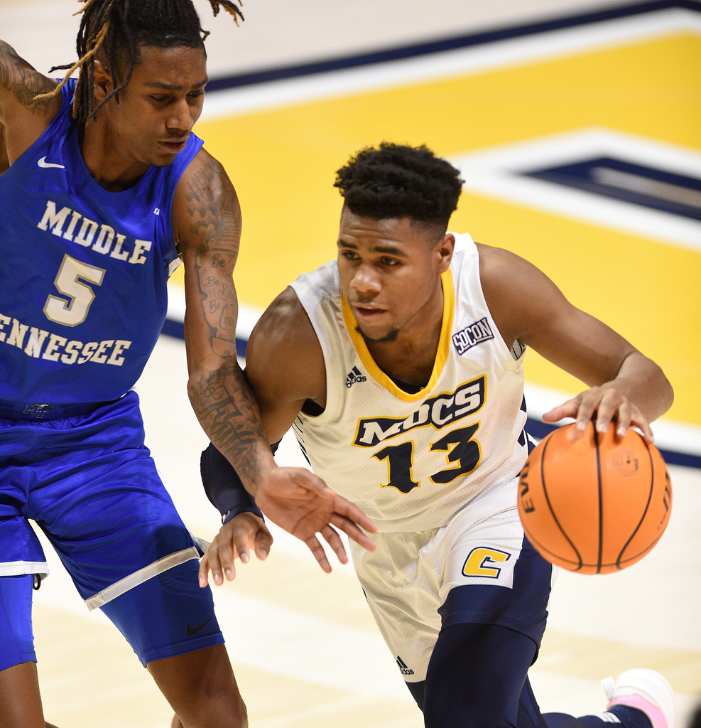 Staff Photo by Matt Hamilton / Middle Tennessee State (5) Eli Lawrence defends UTC (13) Malachi Smith as he drives down the court on Wednesday, December 22, 2021 at McKenzie Arena.