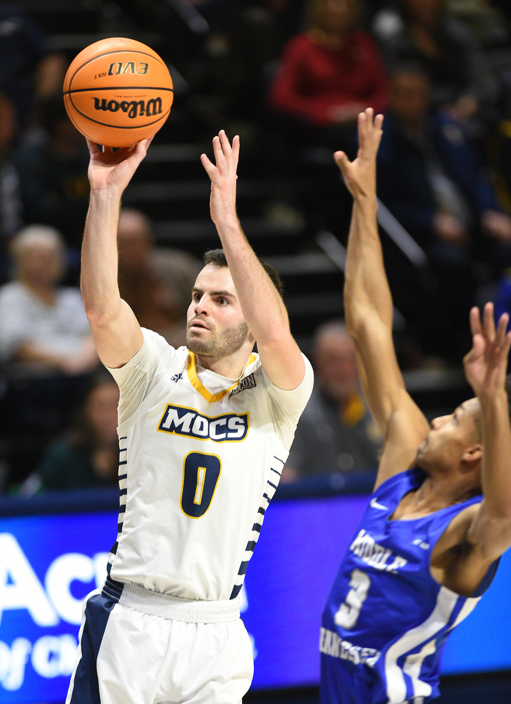 Staff Photo by Matt Hamilton / Middle Tennessee State (3) Donovan Sims defends UTC (0) A.J. Caldwell as he takes a shot on Wednesday, December 22, 2021 at McKenzie Arena.