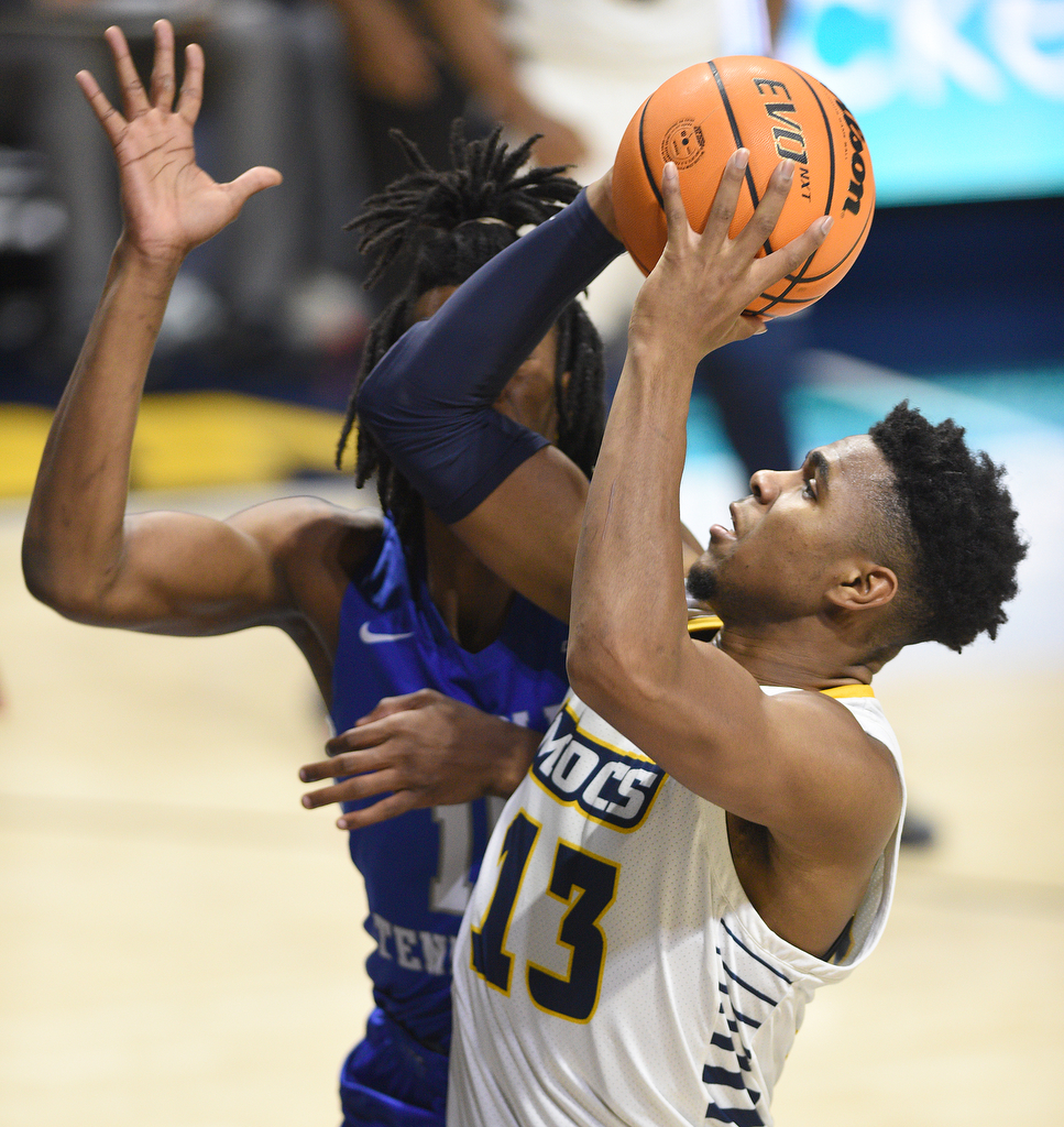 Staff Photo by Matt Hamilton / Middle Tennessee State (15) Christian Fussell defends UTC (13) Malachi Smith as he takes a shot on Wednesday, December 22, 2021 at McKenzie Arena.