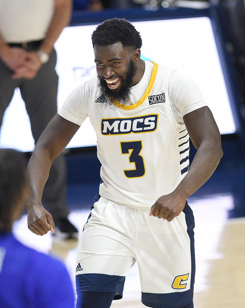 Staff Photo by Matt Hamilton / UTC (3) David Jean-Baptiste flexes after hitting a three-point shot on Wednesday, December 22, 2021 at McKenzie Arena.