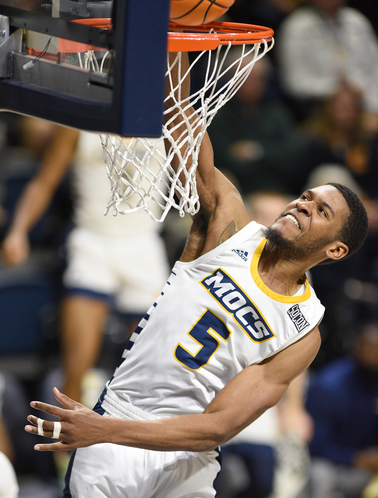 Staff Photo by Matt Hamilton / UTC (5) Darius Banks slams a breakaway dunk on Wednesday, December 22, 2021 at McKenzie Arena.