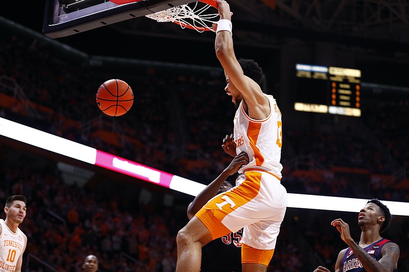 Tennessee Athletics photo / Tennessee forward Olivier Nkamhoua dunks off an assist from Kennedy Chandler during the early stages of Wednesday night's 77-73 topping of previously undefeated Arizona.