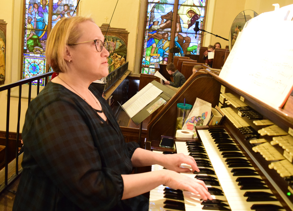Staff Photo by Robin Rudd / Organist Andrea Tierney plays a prelude before the service. The Vigil Mass of Christmas was celebrated at the Basilica of Saints Peter and Paul on December 24, 2021.