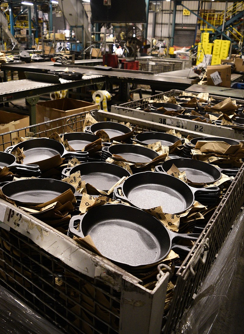 Staff photo by Robin Rudd / Cast iron skillets await shipping in Lodge Cast Iron's South Pittsburg facility on Oct.22, 2021.