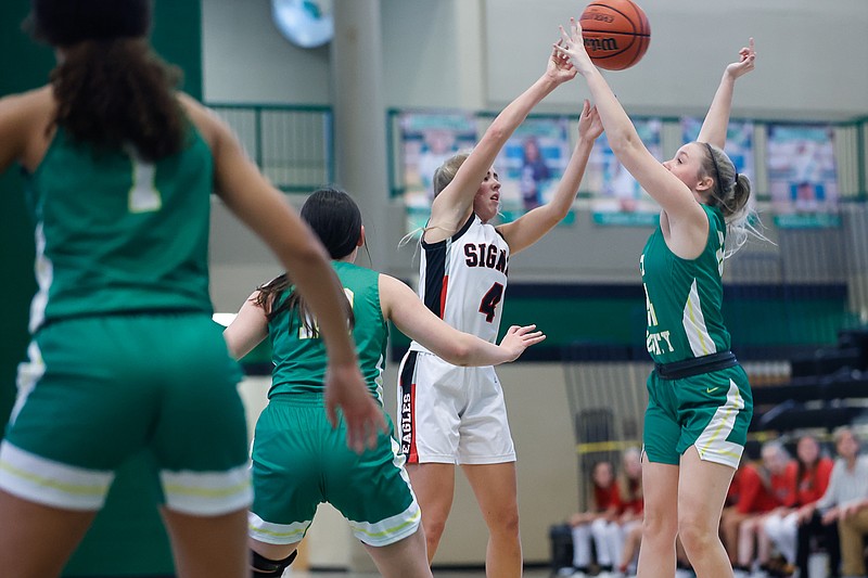 Staff photo by Troy Stolt / Signal Mountain's Meg Clark. (4) passes the ball during the Best of Preps girls basketball tournament game between Signal Mountain and Rhea County at East Hamilton high school on Monday, Dec. 27, 2021 in Ooltewah, Tenn.